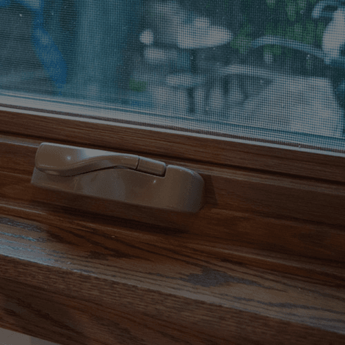 A close-up of a handle on a Casement window.